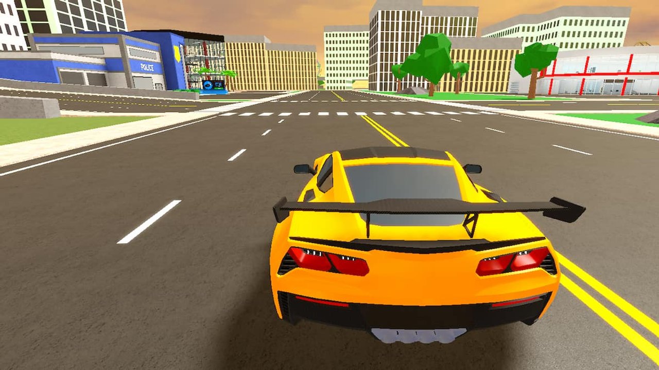 Rear view of a yellow race car driving down a city avenue in Car Dealership Tycoon with dealership buildings on both sides
